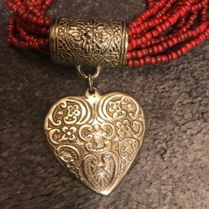 Beaded, Rust 10” Necklace with a silver heart adornment.